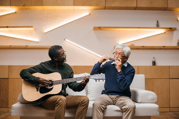 senior friends playing music