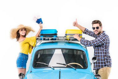 tourists standing by car clipart