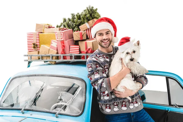 Man with dog and christmas gifts on car — Stock Photo, Image