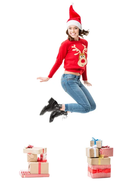 Jumping woman in christmas sweater — Stock Photo, Image