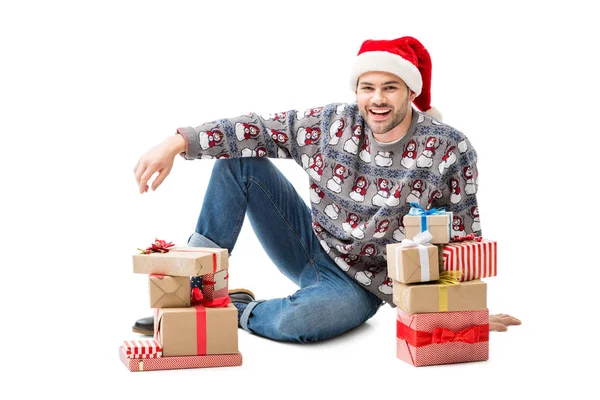 Man sitting on floor with christmas gifts — Stock Photo, Image