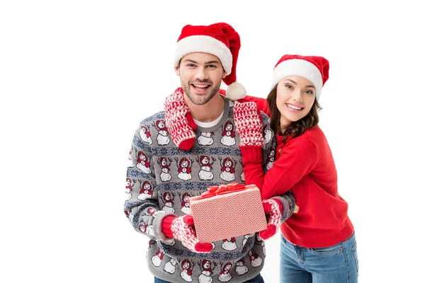 Woman hugging boyfriend with christmas gift — Stock Photo, Image