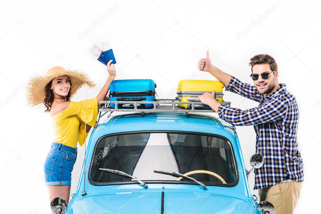 tourists standing by car