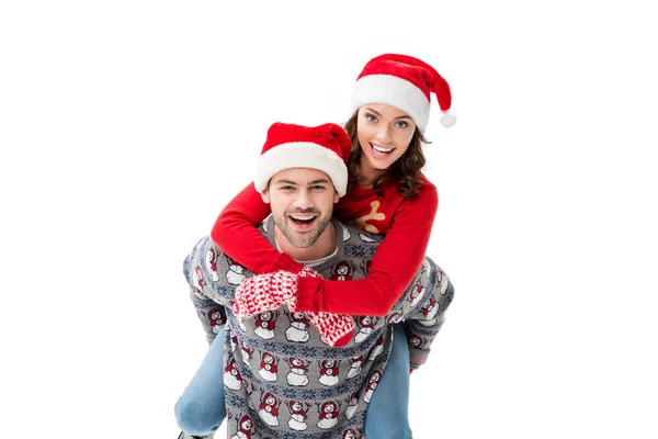 Pareja joven en Santa sombreros — Foto de Stock