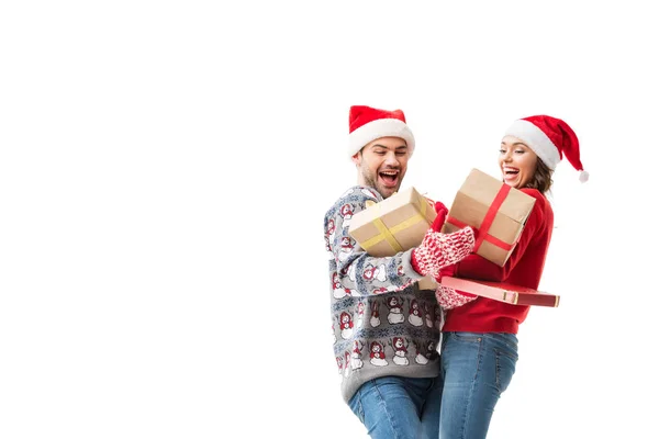 Young couple holding christmas gifts — Stock Photo, Image