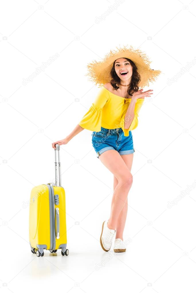 excited woman with luggage