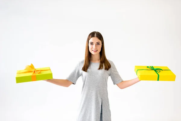 Portrait Smiling Young Woman Holding Presents Hands Isolated White — Free Stock Photo
