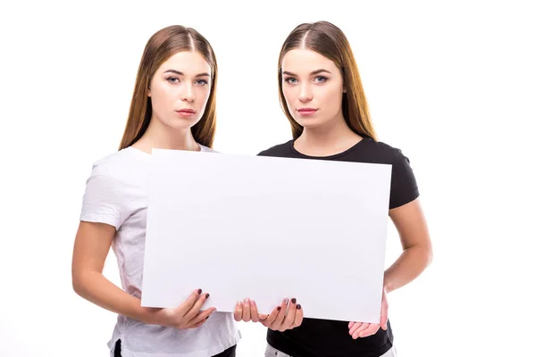 Portrait Beautiful Twins Looking Camera While Holding Blank Banner Hands — Stock Photo, Image