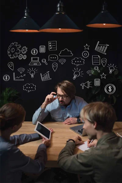 Businesswoman Showing Something Tablet Her Partners Sitting Table Hand Drawn — Free Stock Photo