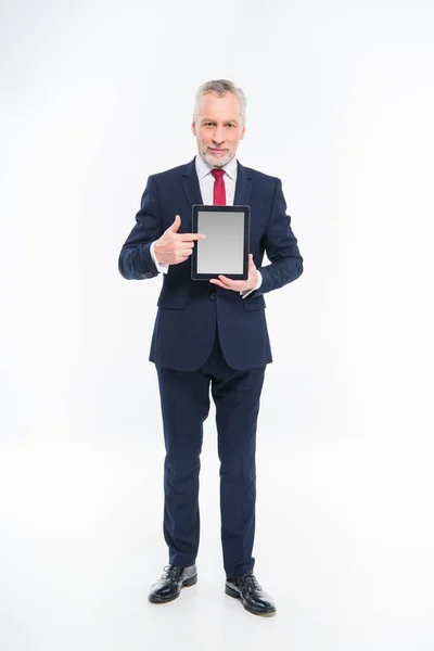 Businessman holding digital tablet — Stock Photo