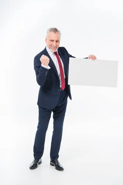 Businessman holding blank card — Stock Photo