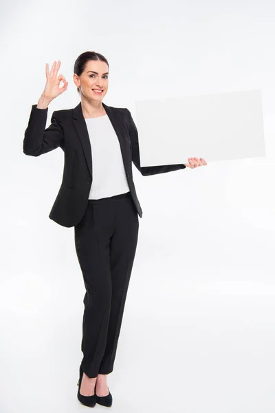 Businesswoman holding blank card — Stock Photo