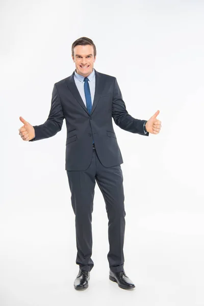 Businessman showing thumbs up — Stock Photo