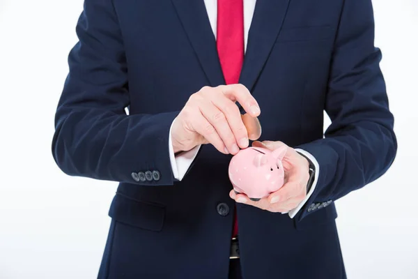 Geschäftsmann mit Sparschwein — Stockfoto