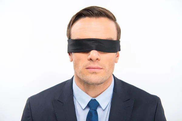 Young businessman in blindfold — Stock Photo