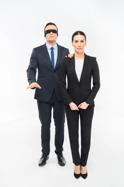 Businessman in blindfold and businesswoman — Stock Photo
