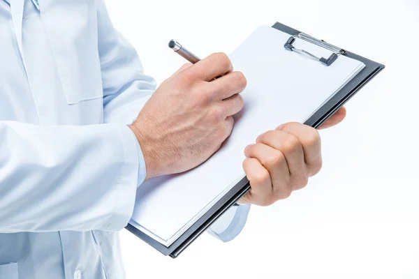 Doctor holding clipboard — Stock Photo