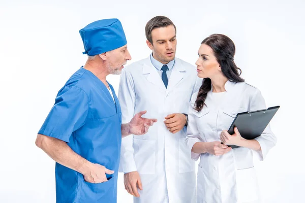 Three doctors chatting — Stock Photo