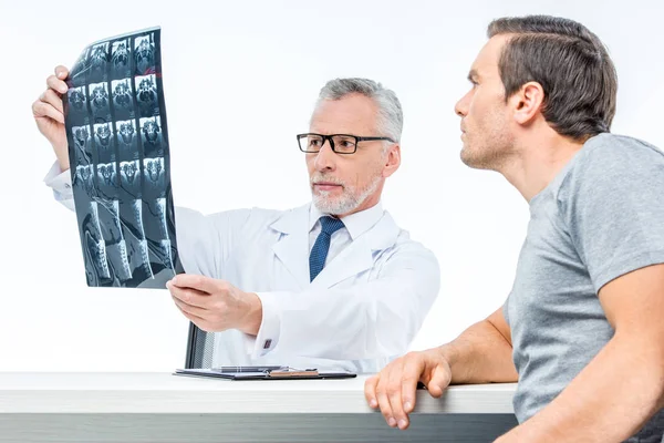 Doctor shows x-ray image — Stock Photo