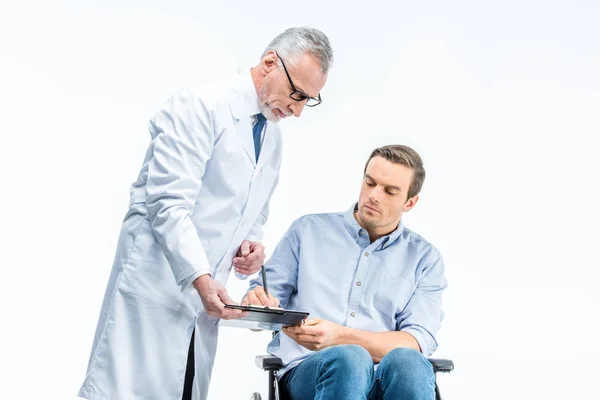 Handicapped man and doctor — Stock Photo
