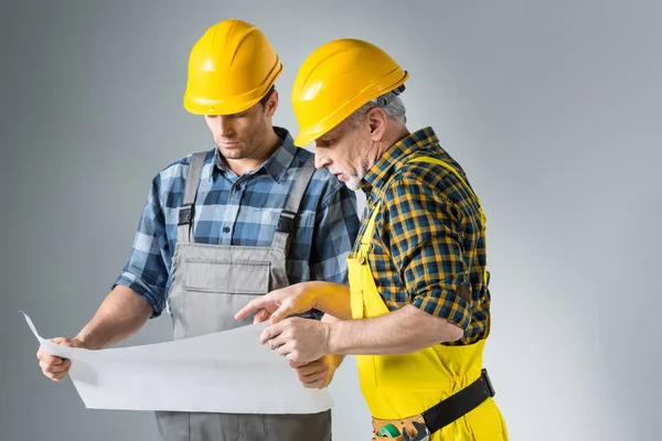 Engineers working with blueprint — Stock Photo
