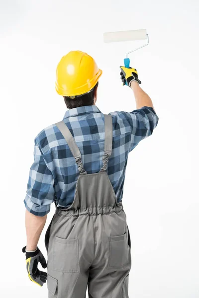 Trabajador con rodillo de pintura - foto de stock