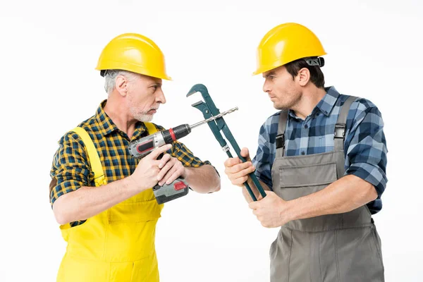 Trabajadores de la construcción con herramientas - foto de stock