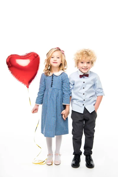 Kids with heart shaped balloon — Stock Photo