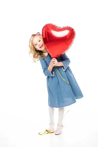 Girl with heart shaped balloon — Stock Photo