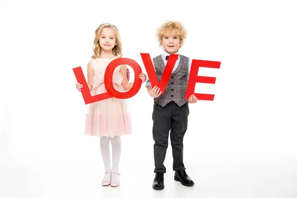 Kids holding word love — Stock Photo