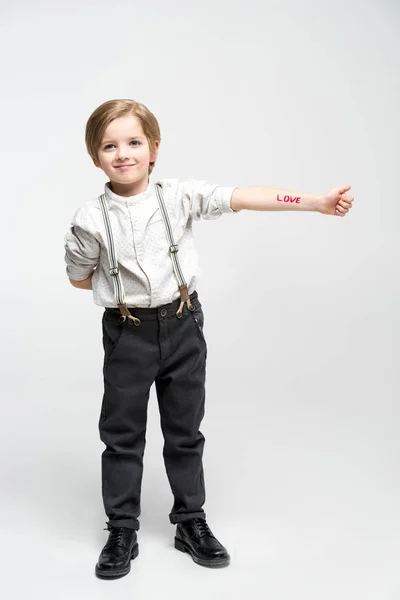 Little boy with word love — Stock Photo