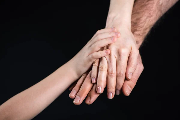 Familie stapelt Hände — Stockfoto