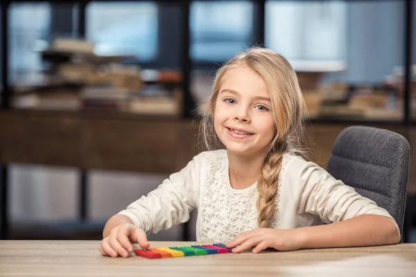 Girl playing with plasticine — Stock Photo