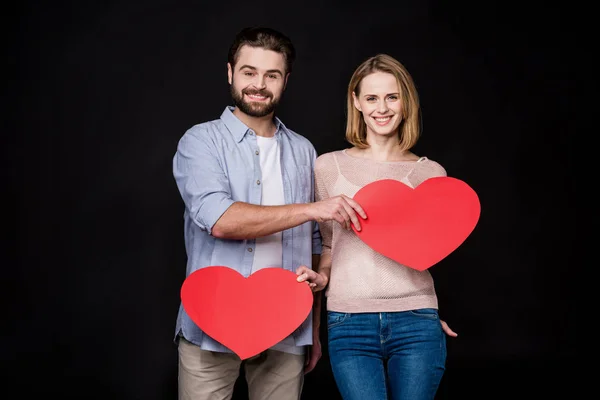 Couple with paper hearts — Stock Photo