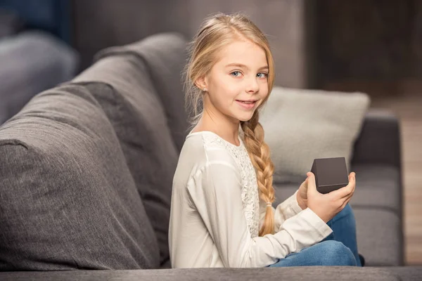 Girl playing with rubik's cube — Stock Photo