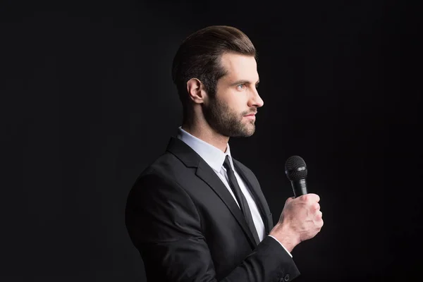 Young man with microphone — Stock Photo