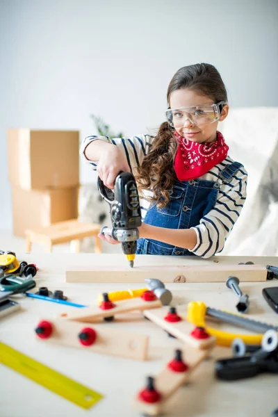 Little girl with tools — Stock Photo