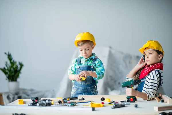 Boy and girl with tools — Stock Photo
