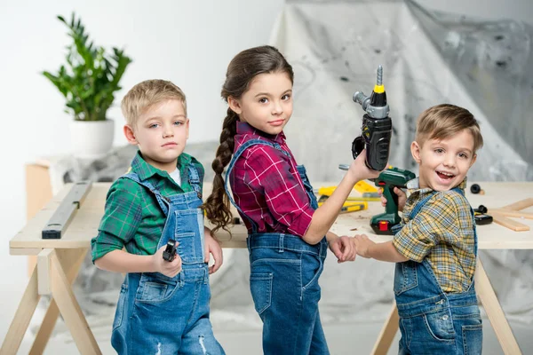 Happy kids with tools — Stock Photo
