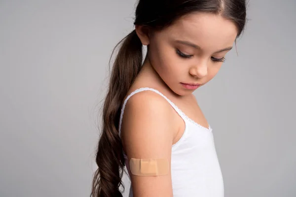 Little girl with patch — Stock Photo