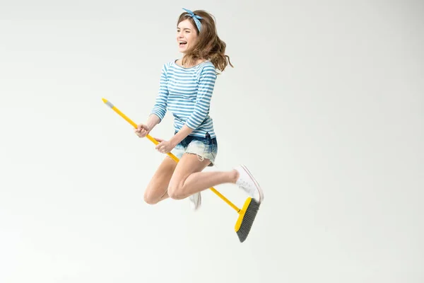 Young woman with broom — Stock Photo