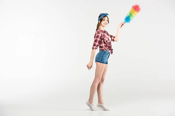 Young woman with duster — Stock Photo