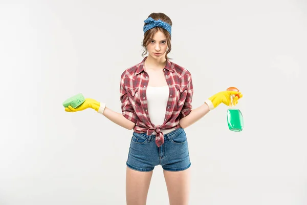 Woman with sponge and spray bottle — Stock Photo