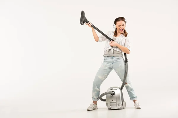 Mujer con aspiradora - foto de stock