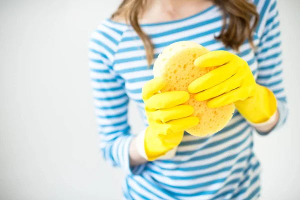 Woman holding sponge — Stock Photo