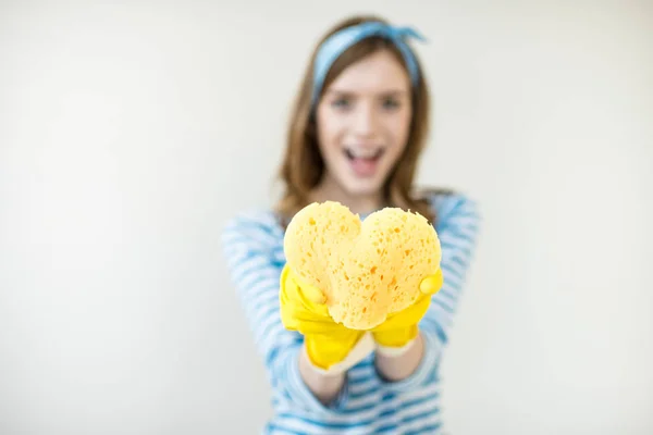 Woman holding sponge — Stock Photo