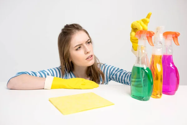 Woman with spray bottles — Stock Photo