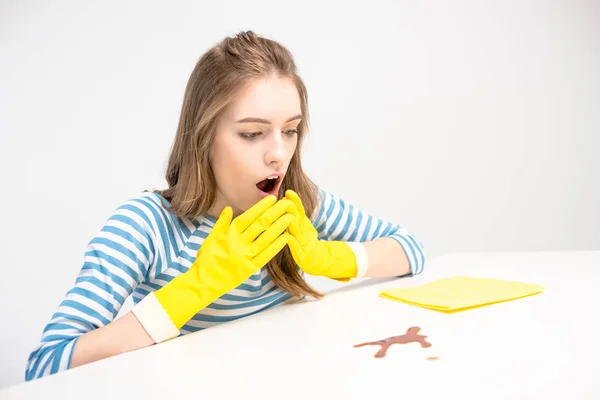 Shocked woman looking at stain — Stock Photo