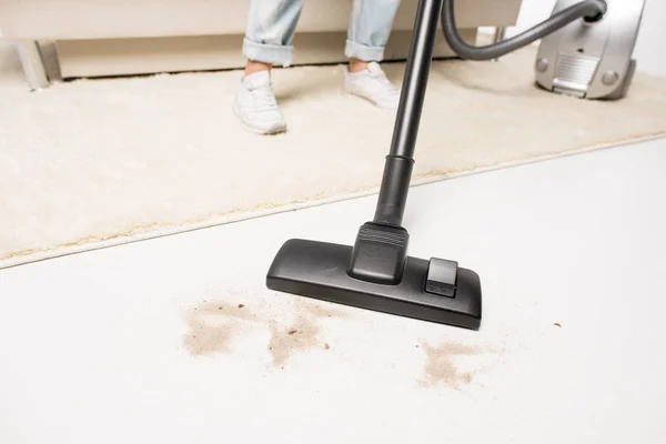 Woman with vacuum cleaner — Stock Photo