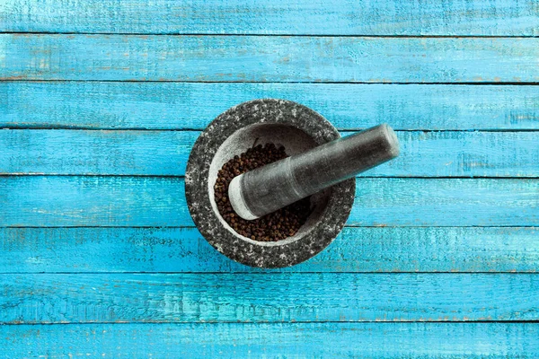 Mortar and pestle on table — Stock Photo